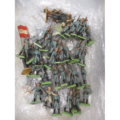 189 - Large unboxed collection of metal and plastic figures in 2 boxes, range of makers including Britains... 