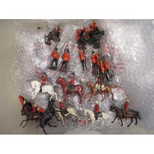 189 - Large unboxed collection of metal and plastic figures in 2 boxes, range of makers including Britains... 