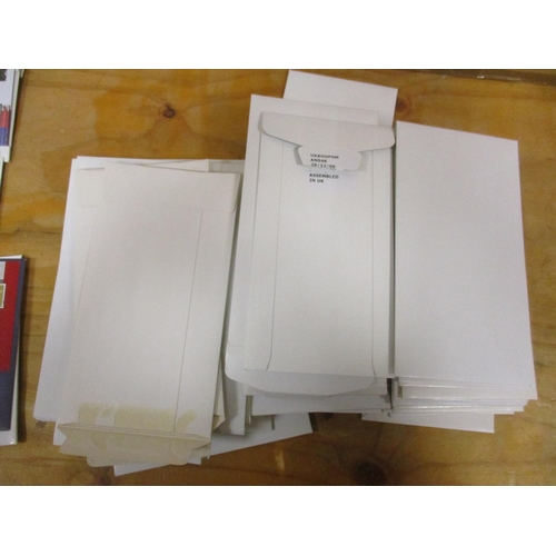 437 - Coln of various numismatic covers in cardboard envelopes, with ranges of £5, £2, £1, 50p and medalli... 