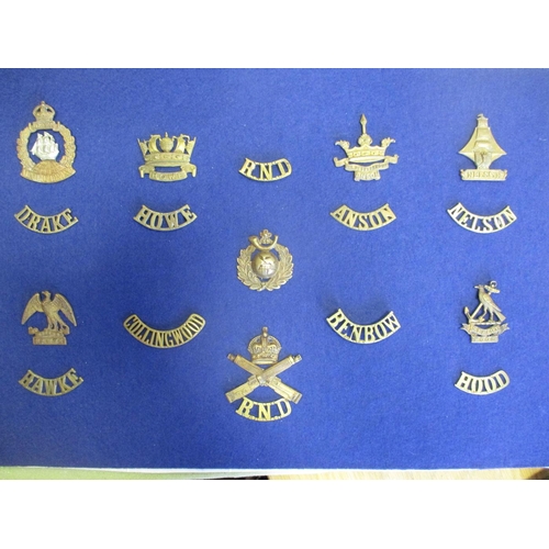 115 - Royal Navy Division mainly badge collection mounted on 4 boards including silk postcard, sweetheart ... 