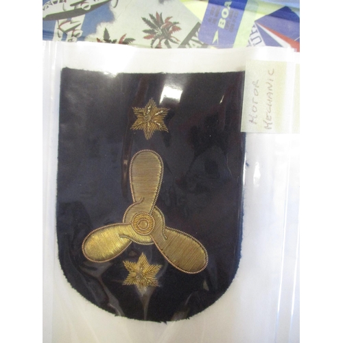 117 - Royal Navy rank badge collection in album with bullion (17) and embroided (31) with wide range of tr... 