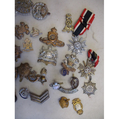 118 - Mixed collection, mainly metal cap badges, shoulder titles, sweetheart badges, trade badge, odd Germ... 