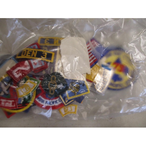 147 - Scout collection including large blanket poncho with wide range of badges, pennants and belt sewn on... 