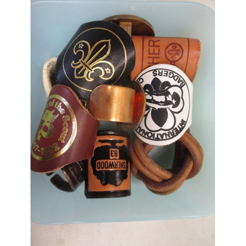 149 - Scout collection in 3 tubs including leather belt and Allzeit Bereit buckle, woggles, cloth badges, ... 