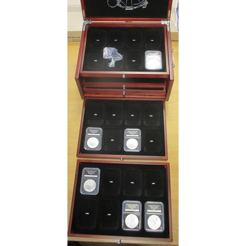 739 - USA. Collection in 4 wooden presentation cases with Historic Silver Dollars range by Danbury Mint wi... 