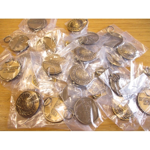 97 - A stock of 30 un-ribboned UN Medals in individual plastic bags, mint. Qty 30 (T)