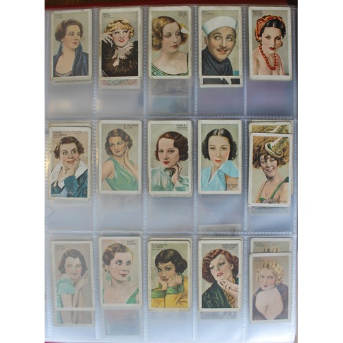 25 - Collection in albums and frames with sets including Wills Household Hints, Flowering Trees and Shrub... 