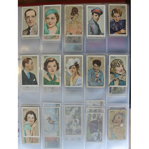 25 - Collection in albums and frames with sets including Wills Household Hints, Flowering Trees and Shrub... 