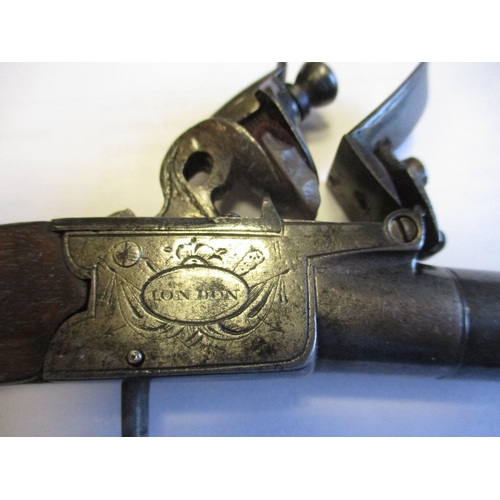 106 - Boxlock flintlock pistol by Dutton of London, screw off barrel, drop down trigger, overall length 15... 