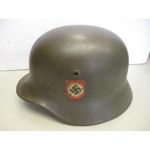 131 - Waffen SS M40 helmet, double decals, Q64 to left side, rear marking erased, with leather liner and c... 