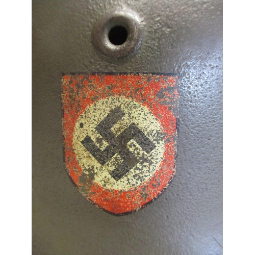 131 - Waffen SS M40 helmet, double decals, Q64 to left side, rear marking erased, with leather liner and c... 