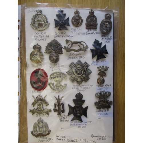 134 - Collection of mainly metal cap badges mounted on cards, wide range of regiments including HLI, Yorsh... 