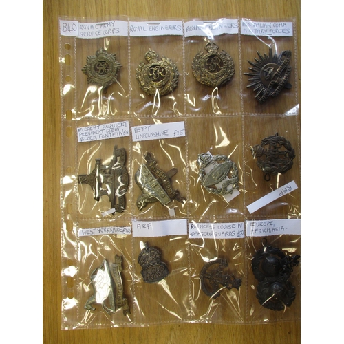 134 - Collection of mainly metal cap badges mounted on cards, wide range of regiments including HLI, Yorsh... 