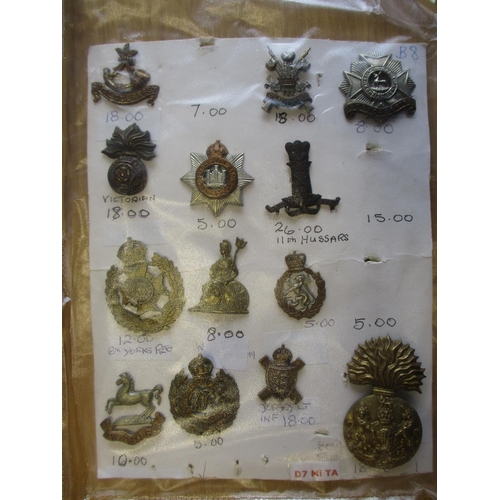 140 - Collection of metal mainly cap badges mounted on cards, wide range of regiments including Malta Mili... 