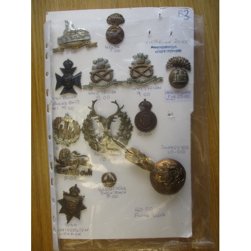 140 - Collection of metal mainly cap badges mounted on cards, wide range of regiments including Malta Mili... 