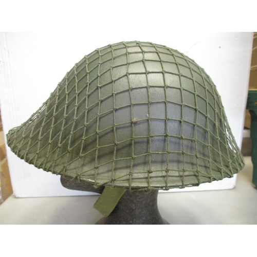 148 - Collection with original WW2 era US helmet with net, British helmet with net, German Army leather be... 