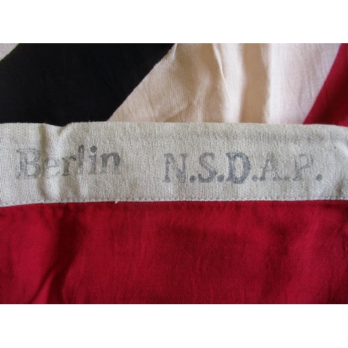 168 - Third Reich N.S.D.A.P. flag, 55cm x 100cm, heading stamped IN BLACK with eagle & swastika 55x100 194... 