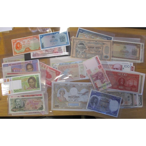 233 - Large, wide ranging accumulation of world banknotes in plastic wallets, generally extremely fine to ... 