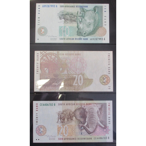 234 - Collection of various world banknotes in album, generally very fine to near uncirculated, includes A... 