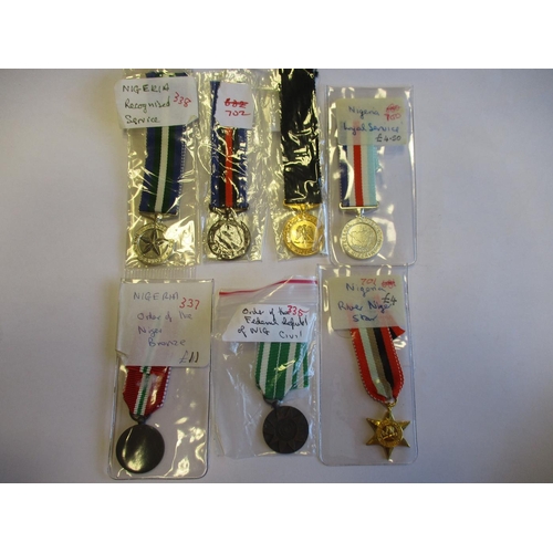 91 - World miniature medal range with Guyana (9), Nigeria (7), Ghana (3), France (3), UN (2) and Malawi ,... 