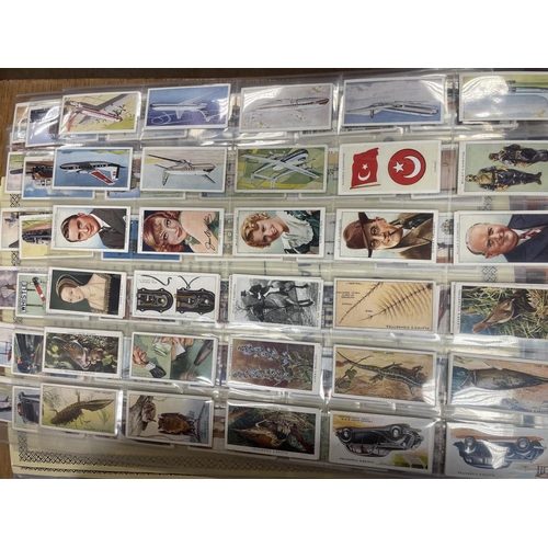 24 - Collection with cigarette and trade cards in plastic sleeves and paper albums with ranges from Barra... 