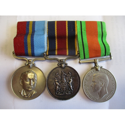 83 - Rhodesia. Husband & wife groups with:
1. Husband's Legion of Merit (Civil), GSM to 4333 J F/R I.A. M... 