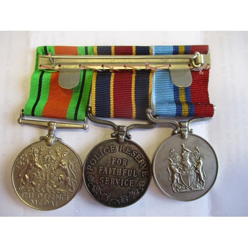 83 - Rhodesia. Husband & wife groups with:
1. Husband's Legion of Merit (Civil), GSM to 4333 J F/R I.A. M... 