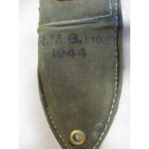 97 - Australian 1944 Mk 1 Machete Bayonet and canvas scabbard, ricasso stamped with broad arrow, grip sta... 