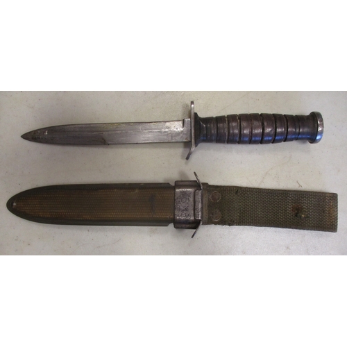 113 - U.S. M3 trench knife with M8 scabbard, blade unmarked, crossguard face marked US M3/Camillus, scabba... 