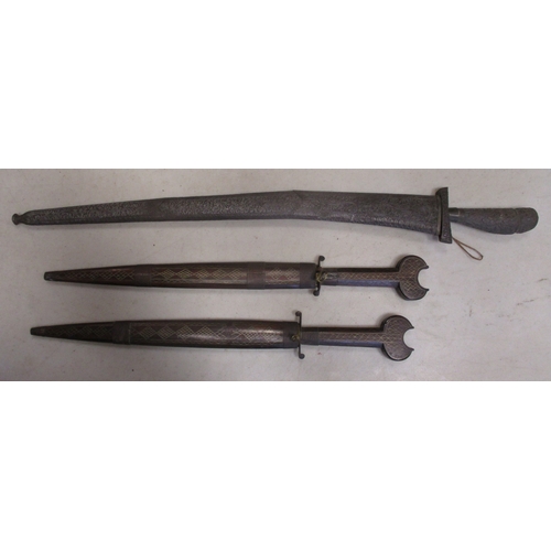 123 - Mainly Asian edged weapon range all with scabbards with Malaysian kris, pair of daggers with wooden ... 