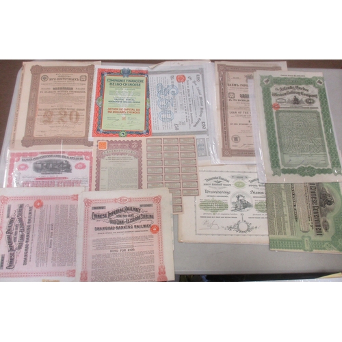 483 - Collection of various world stock and bond certificates, generally very fine or better, strength in ... 