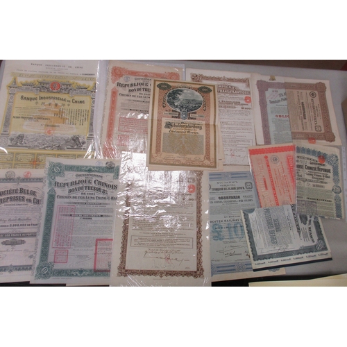 483 - Collection of various world stock and bond certificates, generally very fine or better, strength in ... 