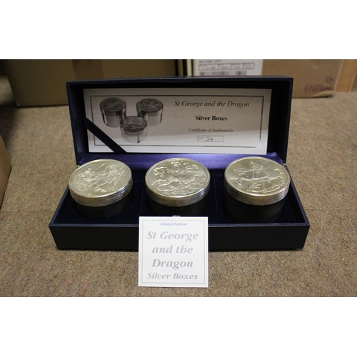 897 - St. George and the Dragon set of three silver boxes in Royal Mint case weighing 6.4, 6.8 and 7.25 tr... 