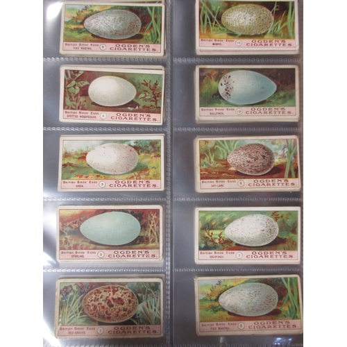 27 - Ogdens. Collection in album with complete and part sets including Birds Eggs (46), Captains of Assoc... 