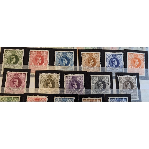 21 - British Africa. QV-QEII M/U coln arranged somewhat untidily in 2 stockbooks, on leaves, and loose. K... 