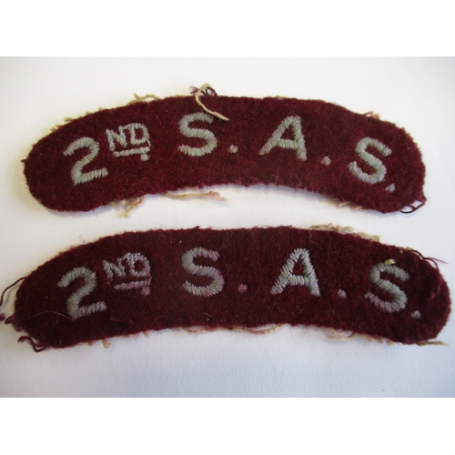 107 - S.A.S. Lilly collection. A pair of 2nd S.A.S. cloth shoulder titles, light blue embroided letters on... 