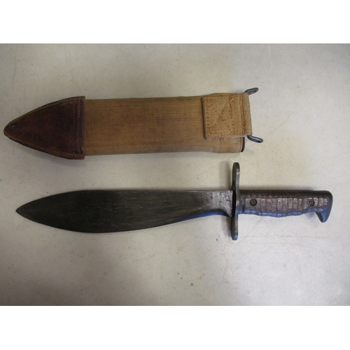 187 - U.S. Model 1917 Bolo knife and scabbard, ricasso stamped MOD191*, canvas covered scabbard, leather c... 