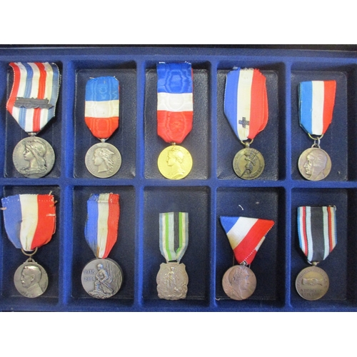 123 - France. Medal collection in 4 trays including Colonial Artillery Medal, WW1 Dardanelles Medal, AND r... 