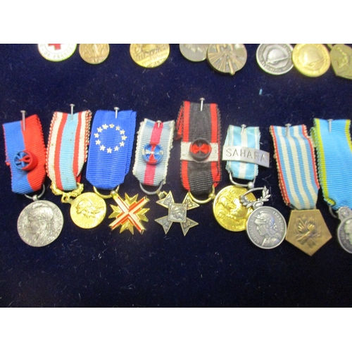 130 - France. Miniature medal collection, 9 are enamelled, in presentation glass topped tray including Med... 