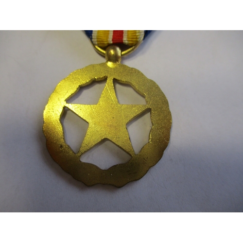 135 - France. Medal For The War Wounded, rare version with red enamel voided star surrounded by gilt wreat... 