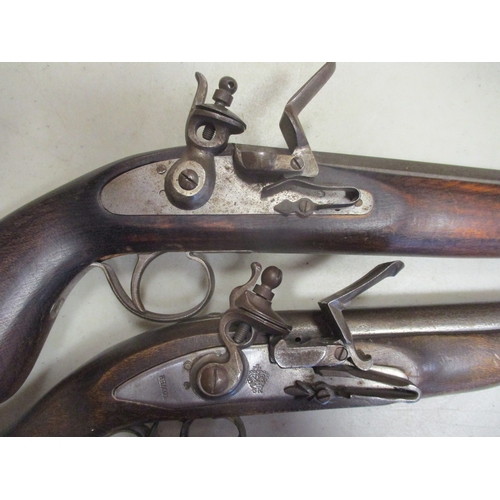 155 - Range of reproduction flintlock pistols with:
1. Good quality copy, lockplate marked Tower and crown... 