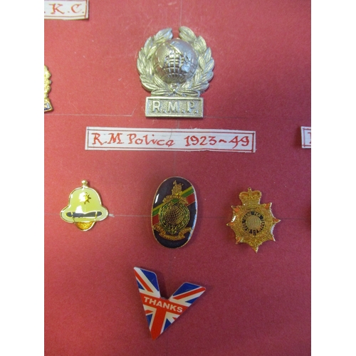 233 - Royal Marines brooch & lapel badge collection on board with RMLI, Band, Police, sweetheart etc inclu... 