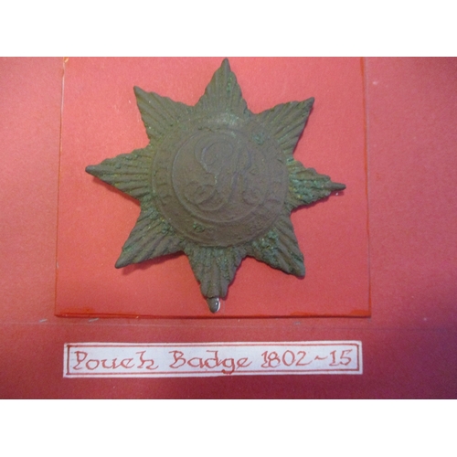 244 - Royal Marines badge relics wire mounted on board for display with pouch badge (1802-15), shoulder sc... 