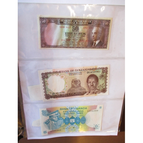 469 - World collection in album many countries represented with Taiwan, Ireland 1975 £1 extremely fine, Ch... 