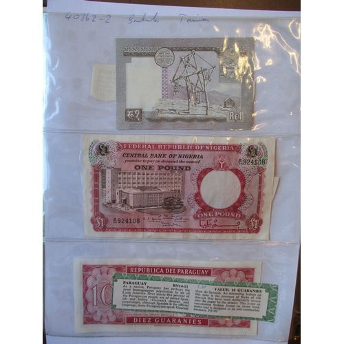 469 - World collection in album many countries represented with Taiwan, Ireland 1975 £1 extremely fine, Ch... 