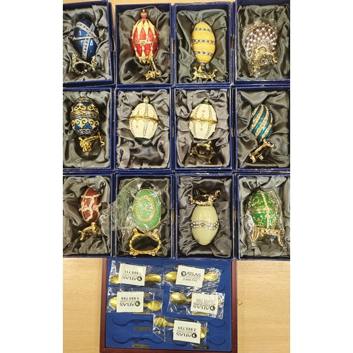 157 - Collection of Atlas edition Faberge decorative eggs (12) and spoons (5) mint in good to very good bo... 