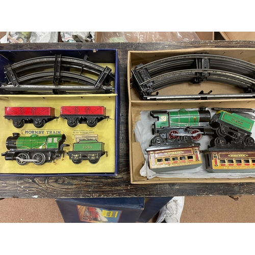 388 - Hornby. Collection of O gauge including clockwork sets with keys (2), clockwork locomotives with rep... 