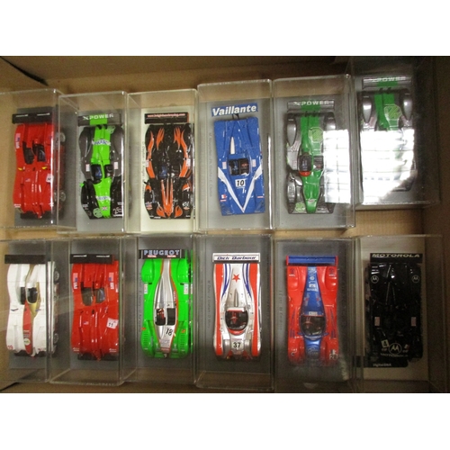 238 - Collection of race cars plinthed in display cases generally mint in mint boxes. Qty 25 (B)