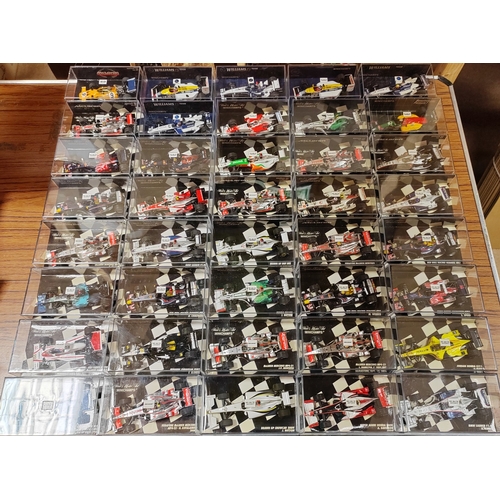 340 - Minichamps. Collection of F1 cars generally mint in very good to near mint plastic display cases. Qt... 