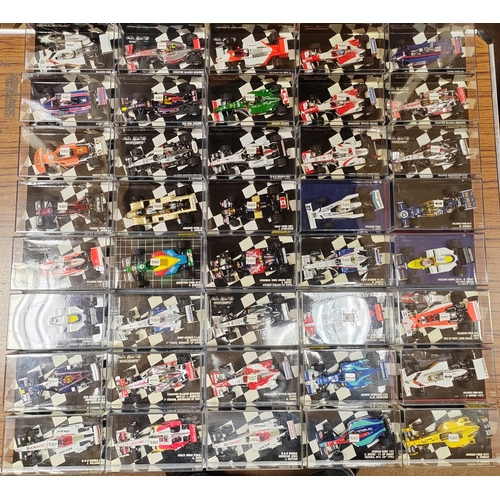 342 - Minichamps. Collection of F1 cars generally mint in very good to near mint plastic display cases. Qt... 